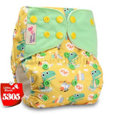 Yellow diaper with green frog pattern and green cover