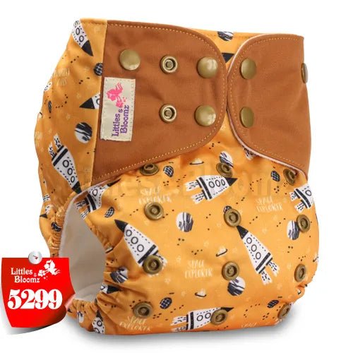 Orange cloth diaper with brown flap and pattern, featuring 'Littles & Bloomz' brand.