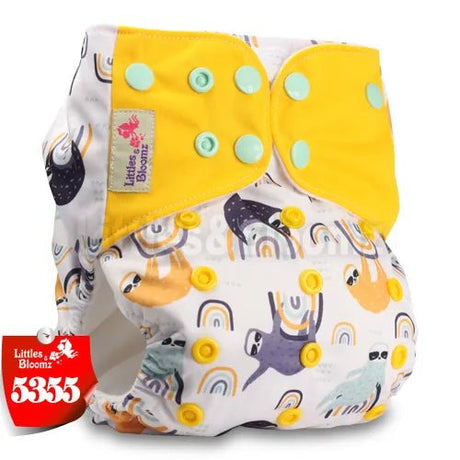 Patterned diaper with yellow accents and cartoon designs, featuring the brand 'Littles & Bloomz'.