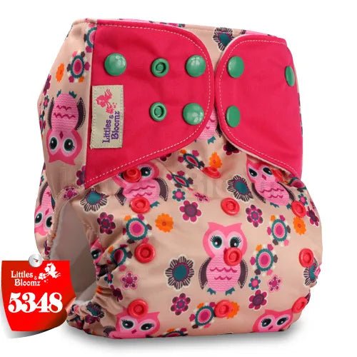 Floral and owl-patterned diaper with pink accents.