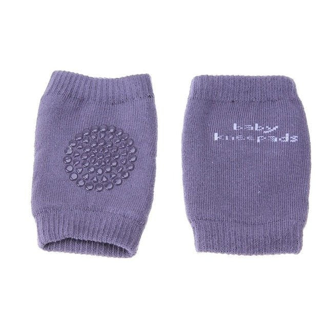 Pair of purple baby knee pads with textured surface.