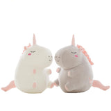 Two plush toys resembling unicorns.