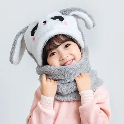 Child wearing a gray bunny hat and scarf