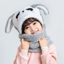 Child wearing a gray bunny hat and scarf