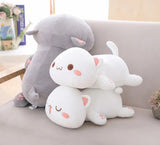 Two plush toys, one gray and one white with pink accents