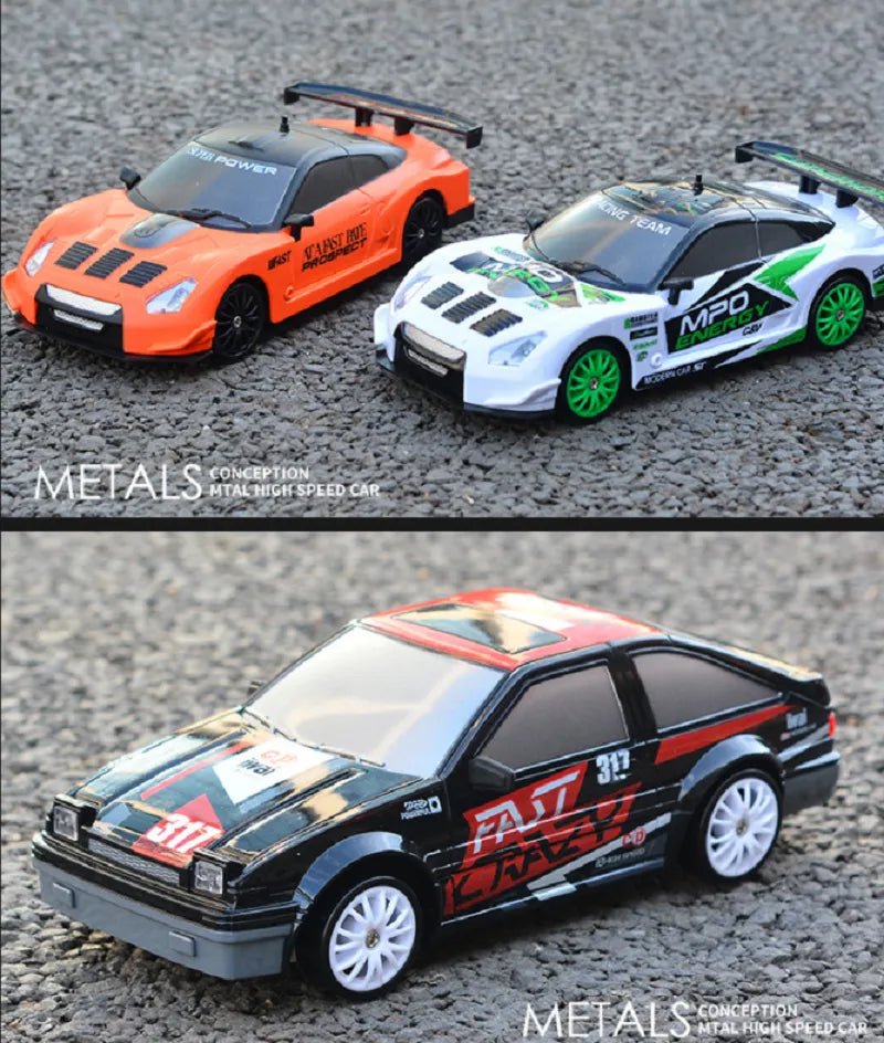 Three toy cars with racing decals on a textured surface
