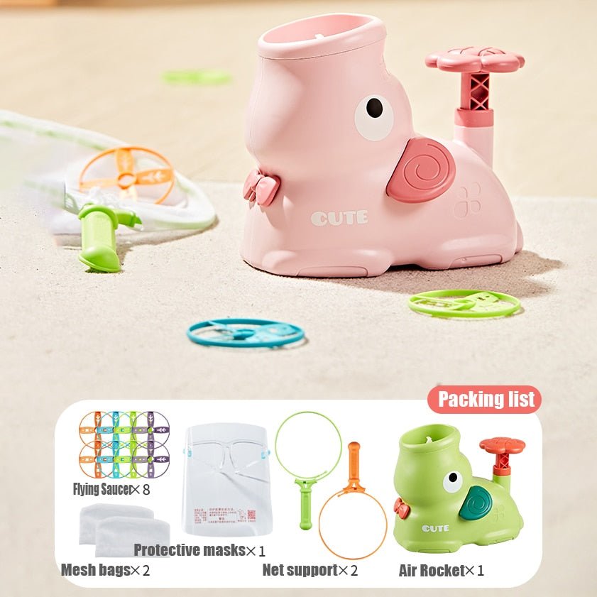 Pink toy with accessories on a beige surface, including a packing list of items.
