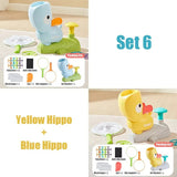 Two toy hippos, one yellow and one blue, with packaging and accessories 