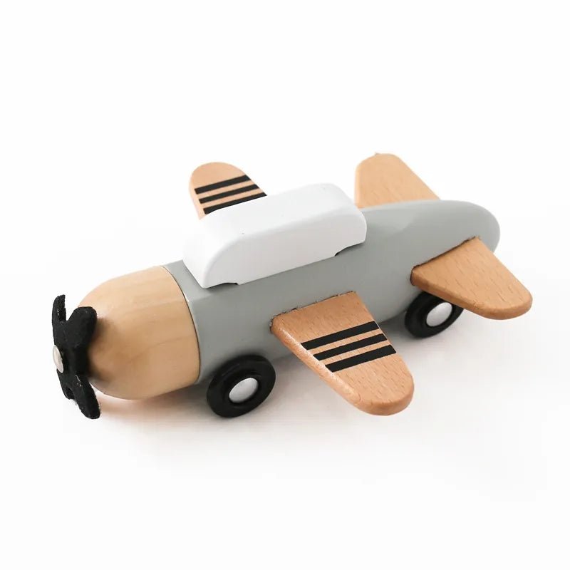 Montessori wooden train and trolley activity toy set including a wooden toy airplane accessory piece.