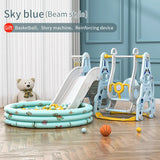 Children's play area with sky blue slide, pool, and playground equipment in a room.
