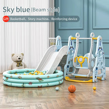 Children's play area with sky blue slide, pool, and playground equipment in a room.
