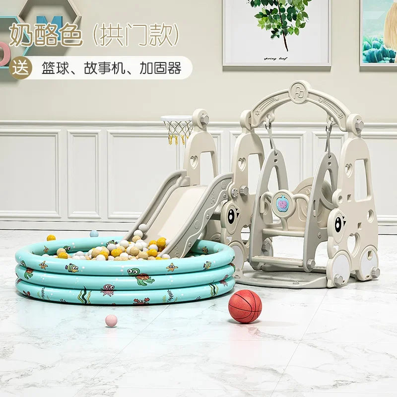 Children's play set with slide, swing, and inflatable pool on a light wooden floor.