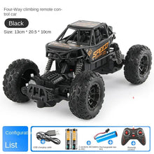 Black four-way climbing remote control car with included accessories 