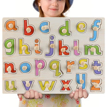 Child holding a Montessori wooden alphabet puzzle with letters A to Z as a pre-K learning material.