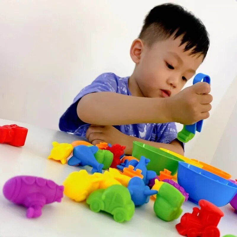 Child playing with colorful sand toys 