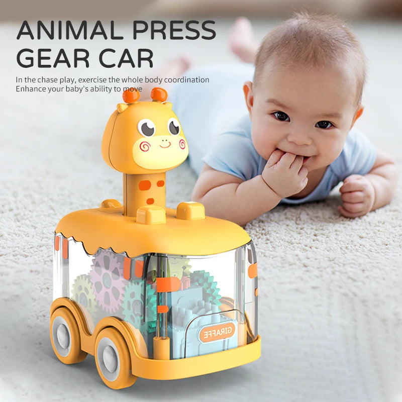 Yellow animal press gear car toy on a rug with a baby lying nearby