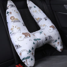 U-Shape Kids Travel Pillow with animal print fitted on a car seat for gentle head support during travel naps.