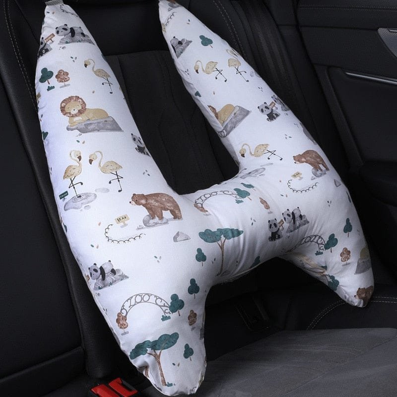 U-Shape Kids Travel Pillow with animal print fitted on a car seat for gentle head support during travel naps.