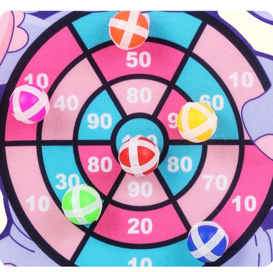 Colorful target game with numbered sections and toy balls.
