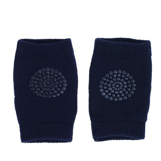 Pair of navy blue knee pads with a circular pattern.