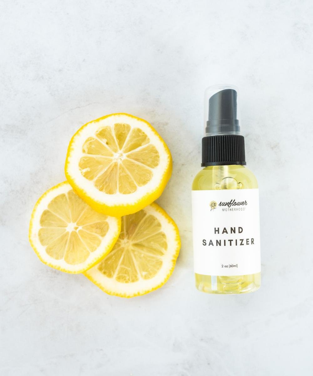 Hand sanitizer bottle with lemon slices.