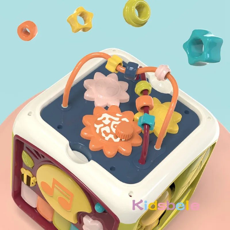 7-in-1 Baby Activity Cube multi-sided educational toy for shape sorting, bead sliding, and musical discovery play.