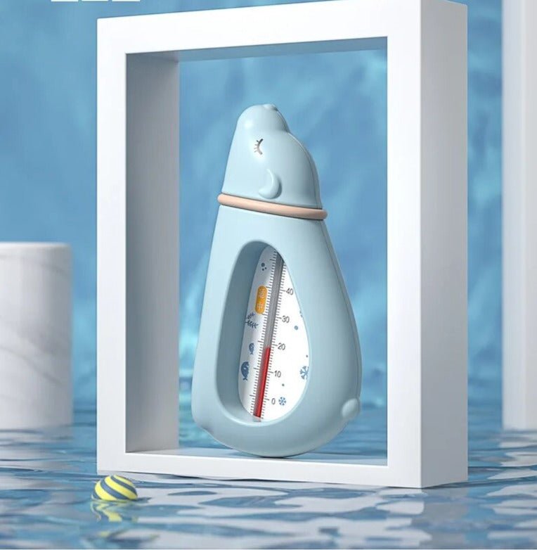 Baby Bath Thermometer in a bottle shape floating in water for easy temperature reading during newborn bathing.