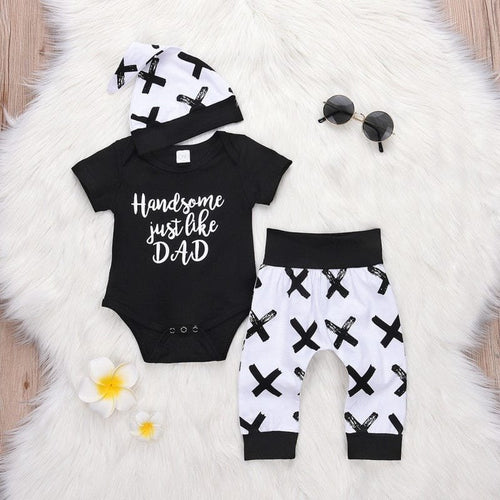 Baby boy black bodysuit with printed pants and hat three-piece set for daily wear and newborn photo sessions.