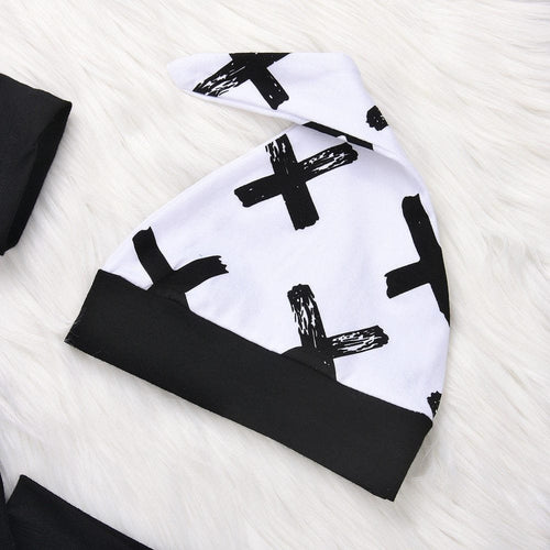 Patterned baby hat from the black and white three-piece boy set for nursery days and outdoor outings.