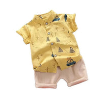 Yellow patterned shirt and pink shorts baby summer set for warm-weather outings and photos.