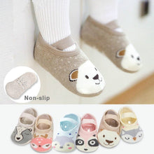 Cartoon animal baby floor socks with non-slip grip soles for safe indoor crawling and first steps.
