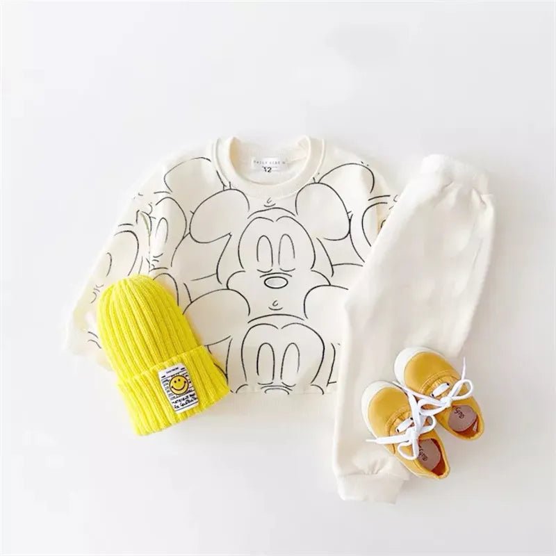 Baby outfit with a white shirt, a yellow hat, and shoes.