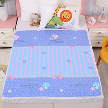 Children's bed with a colorful Starbucks-themed blanket and pillows.