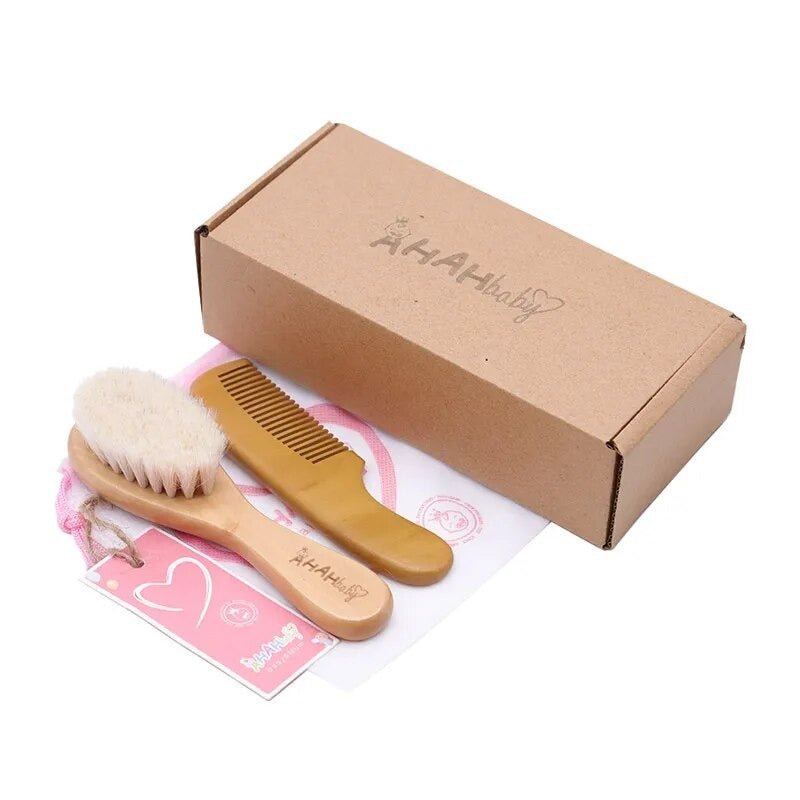 Fine tooth baby comb from the newborn set for gentle hair styling after baths and before family photos.