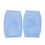Pair of light blue knitted baby leg warmers.