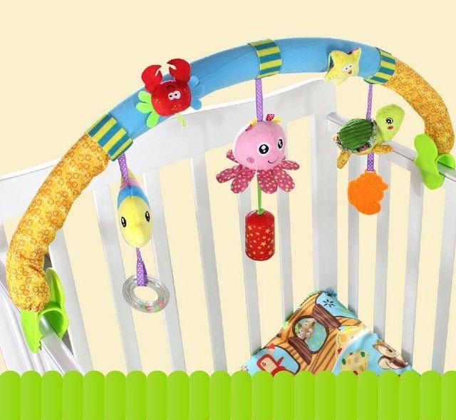 Baby crib arch toy with hanging plush pieces suited for both crib and car seat use.