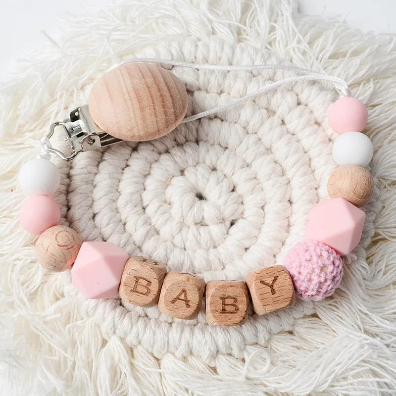 Baby dummy clip with silicone beads and custom lettering, a teether accessory for soothing and easy dummy access.