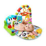 Baby playing with a colorful activity gym.