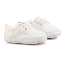Pair of white baby shoes