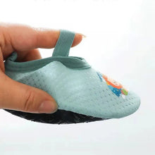 Cute Baby Floor Sock Shoes soft sole anti-skid design shown in flat lay for soft sole comfort for infant feet.