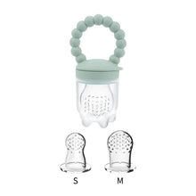 Close-up of the mint green Baby Fruit Feeder Pacifier nibbler used for chilled fruit and teething relief.