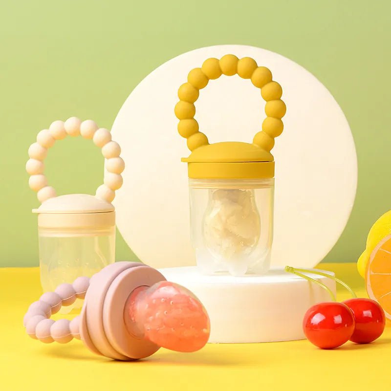Baby Fruit Feeder Pacifier silicone teether set in assorted colours for safe first tastes and teething relief.
