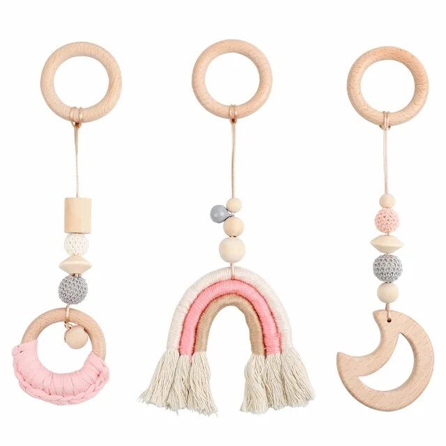 Three wooden baby teething toys with colorful beads and tassel.