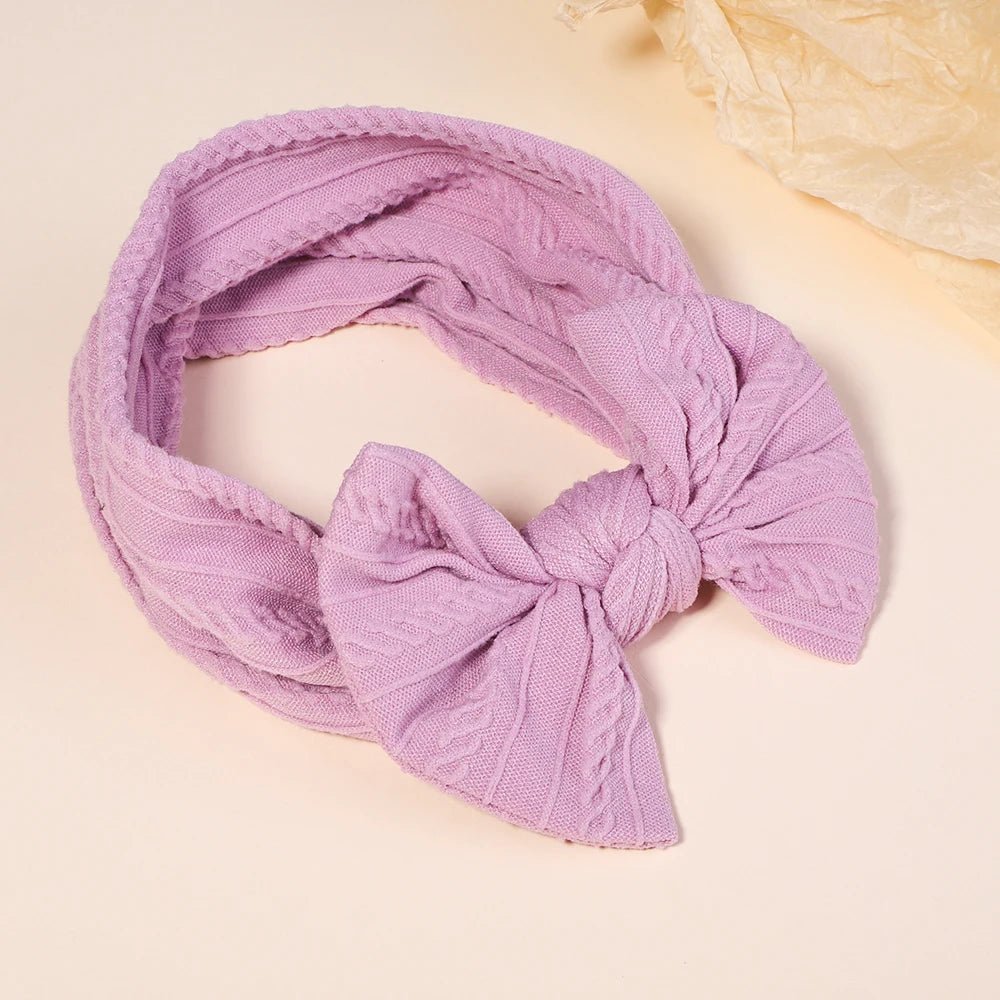 Purple headscarf with a knot.