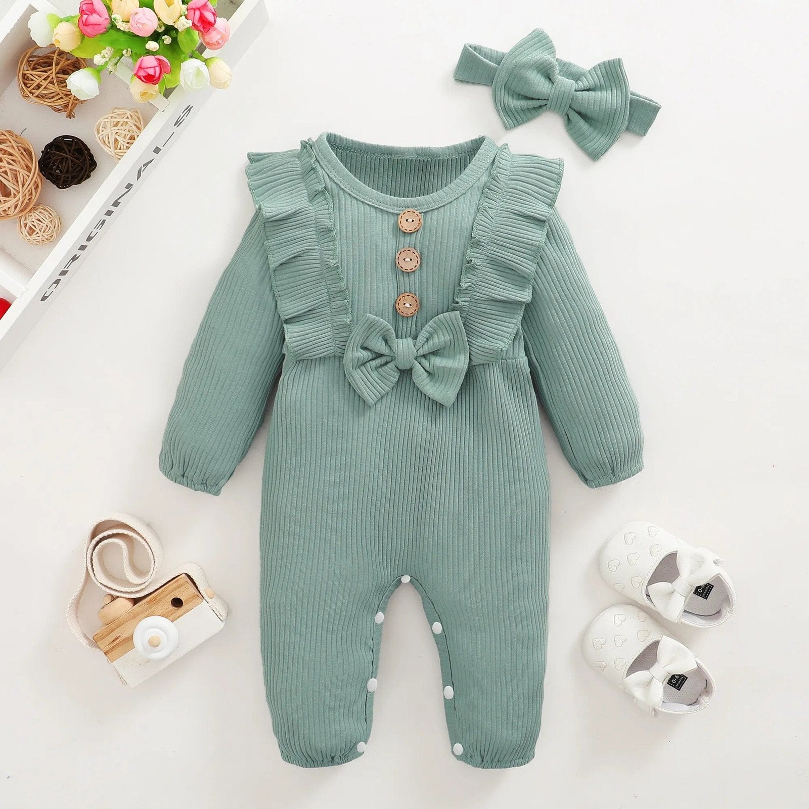 Green long-sleeve baby girl romper with headband for cosy layering and daily nursery wear.