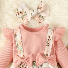Pink ribbed baby sweater with floral suspender trousers and headband for photo sessions and family outings.