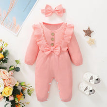 Full view of the pink ruffle baby girl romper and bow headband for photo sessions and daily wear.