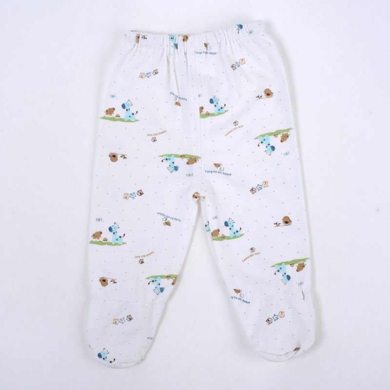 White baby trousers with a cartoon dog print from the newborn gift set, comfy bottoms for crawling, naps, and nappy changes.