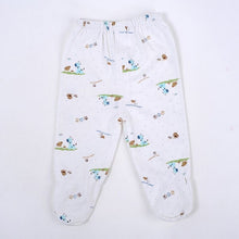 White baby trousers with a cartoon dog print from the newborn gift set, comfy bottoms for crawling, naps, and nappy changes.