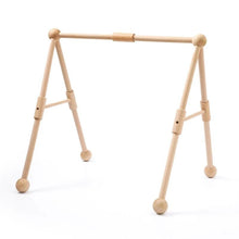 Baby gym wooden frame in a natural finish as an eco nursery toy for everyday play and newborn gifting.